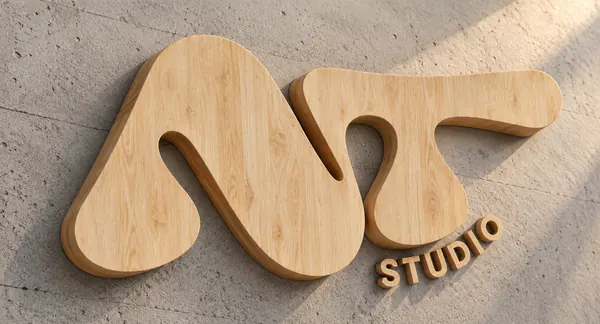 Logotipo NT en letras corpóreas de madera sobre hormigón